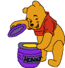 Pooh opening his honey
